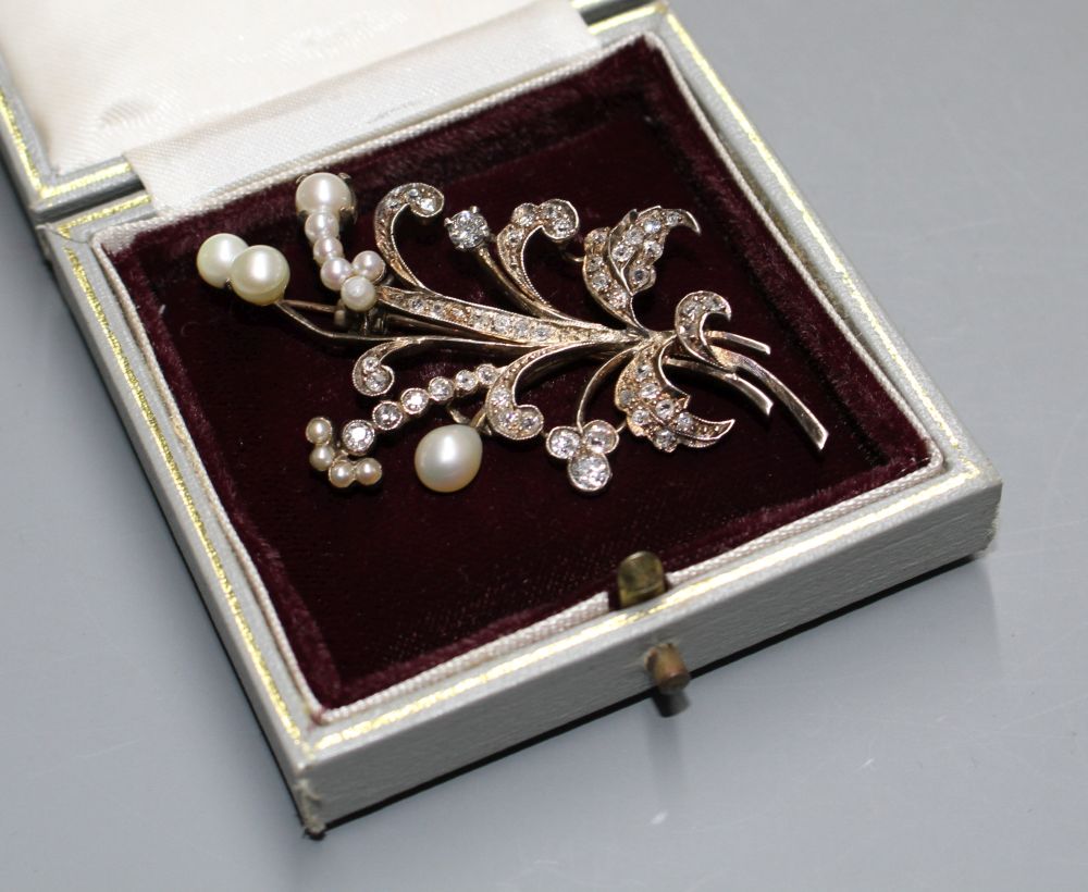 An early-mid 20th century yellow metal, cultured pearl and diamond set floral spray brooch,